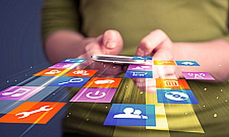 Woman holding smart phone with colorful application icons