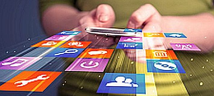 Woman holding smart phone with colorful application icons